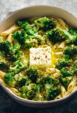 Baked feta and broccoli pasta served in a bowl