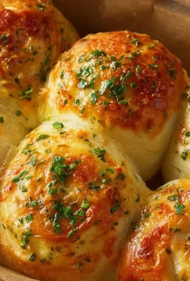 Delicious buttery cheese garlic rolls, fresh out of the oven, ready to enjoy.