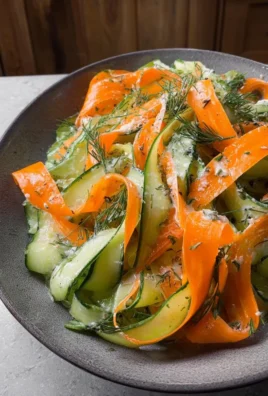 Carrot and cucumber ribbon salad with fresh herbs and dressing