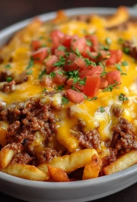Delicious cheeseburger casserole topped with crispy French fries.
