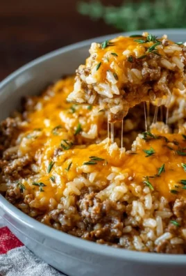 Cheesy ground beef and rice casserole served in a baking dish