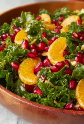 Citrus Pomegranate Kale Salad with fresh ingredients and colorful presentation