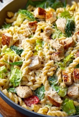 Creamy chicken pasta with mixed vegetables in a bowl