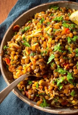 Bowl of Easy Mediterranean Lentils and Rice with fresh herbs and spices