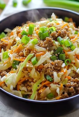 Delicious Egg Roll in a Bowl with fresh vegetables and savory meat.