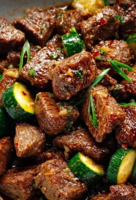 Delicious Garlic Butter Steak Bites served on a plate with herbs