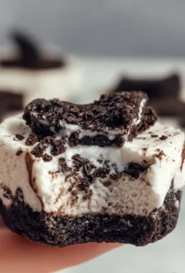 Healthy no-bake Oreo cheesecake bites topped with crushed Oreos.