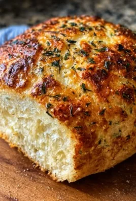 Delicious Italian herbs and cheese bread with a golden crust and flavorful toppings