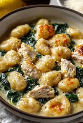Delicious lemon chicken gnocchi served with fresh herbs and lemon slices