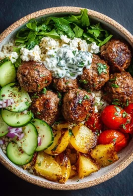 Delicious Mediterranean Meatball Bowl with fresh vegetables and herbs