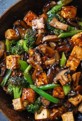 Delicious Mushroom Tofu Stir-Fry in a colorful bowl with fresh vegetables