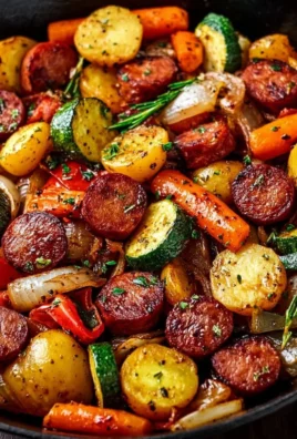 Delicious one-pan honey garlic kielbasa and veggies dish served on a plate.