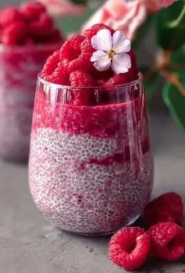 Delicious raspberry chia pudding topped with fresh raspberries and mint