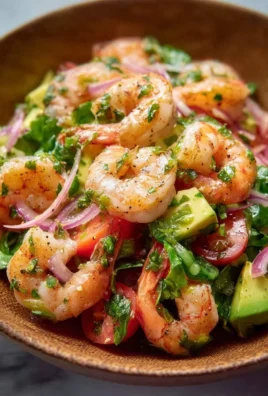 Fresh and colorful shrimp salad with vegetables and dressing