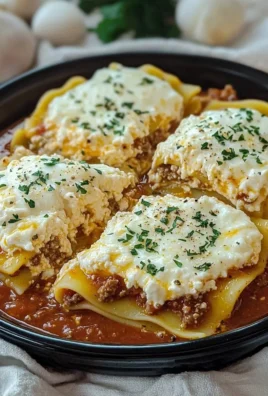 Slow cooker lasagna layered with cheese and sauce in a ceramic dish