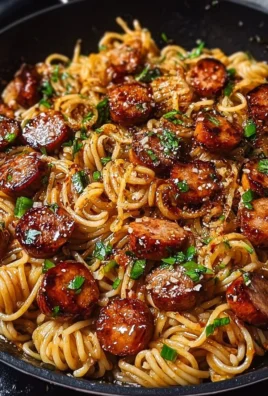 Sticky Honey Garlic Sausage Pasta Skillet served in a skillet dish