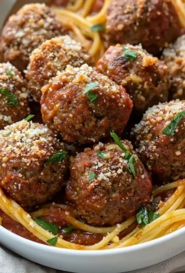 Delicious Baked Italian Meatballs served on a plate with marinara sauce