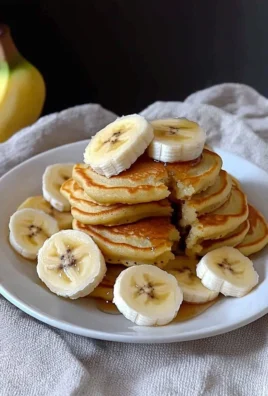 Delicious Banana Mini Pancakes served with syrup and sliced bananas
