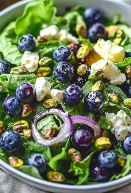 Fresh Blueberry Pistachio Salad with spring greens and vibrant colors