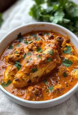 Delicious butter chicken served with rice and naan