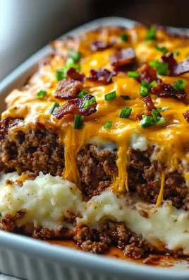 A delicious Cheesy Loaded Meatloaf Casserole topped with melted cheese and loaded with flavors.