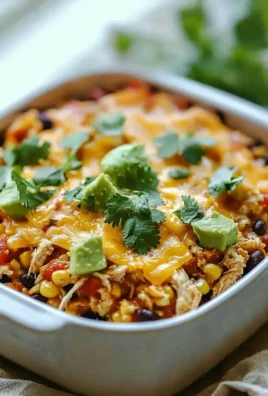 Delicious Chicken Taco Casserole topped with cheese and veggies