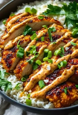 Crispy chicken topped with creamy spicy sauce served with jasmine rice.