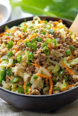 Delicious Egg Roll in a Bowl recipe with fresh vegetables and savory pork.
