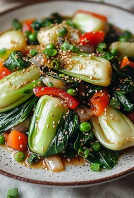 Delicious Garlic Ginger Bok Choy Stir-Fry served on a plate with sesame seeds.