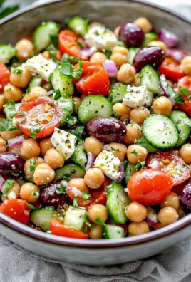 Delicious Greek chickpea salad with fresh vegetables and herbs