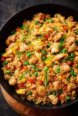 High protein chicken fried rice dish with vibrant vegetables and chicken pieces