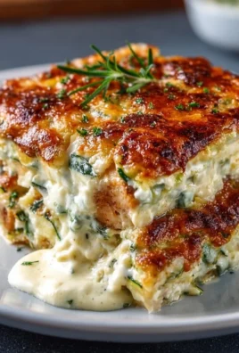 High protein chicken zucchini bake dish, topped with cheese and herbs