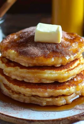 Deliciously fluffy Spanish churro pancakes topped with cinnamon sugar