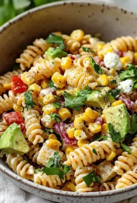 Juicy Street Corn Pasta Salad with fresh ingredients and vibrant colors.