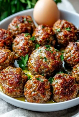 Keto Greek Meatballs Keftedes served with fresh herbs and tzatziki sauce