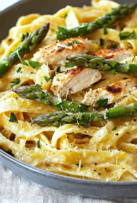 Plate of Lemon Asparagus Pasta garnished with fresh herbs