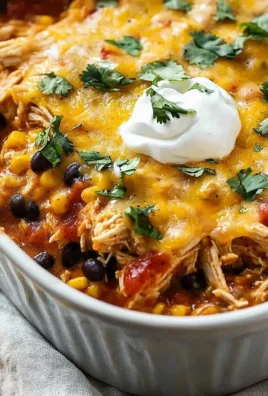 Delicious Mexican Chicken Casserole topped with cheese and fresh ingredients