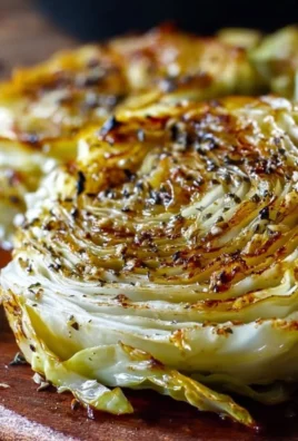 Oven roasted garlic cabbage steaks garnished and ready to serve