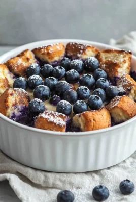 Quick Blueberry French Toast Casserole topped with fresh blueberries and syrup