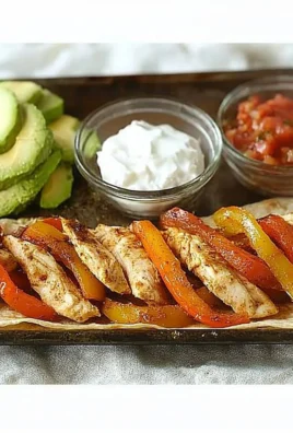 Sheet Pan Chicken Fajitas with colorful bell peppers and seasoned chicken