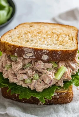 Delicious tuna salad sandwich made with fresh ingredients and served on whole grain bread.