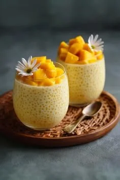 Creamy mango sago dessert topped with fresh mango slices