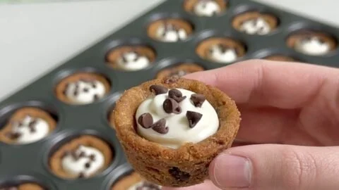 Delicious cheesecake cookie cups topped with fruit, perfect dessert treat