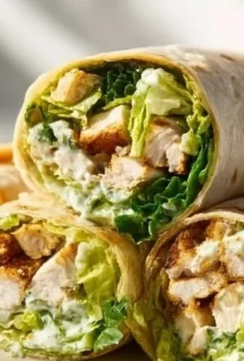 Delicious Chicken Caesar Wrap filled with grilled chicken, romaine lettuce, and Caesar dressing.