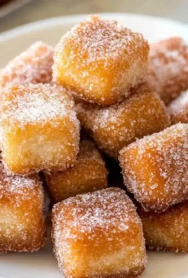 Delicious churro bites sprinkled with cinnamon sugar, a fun dessert treat.