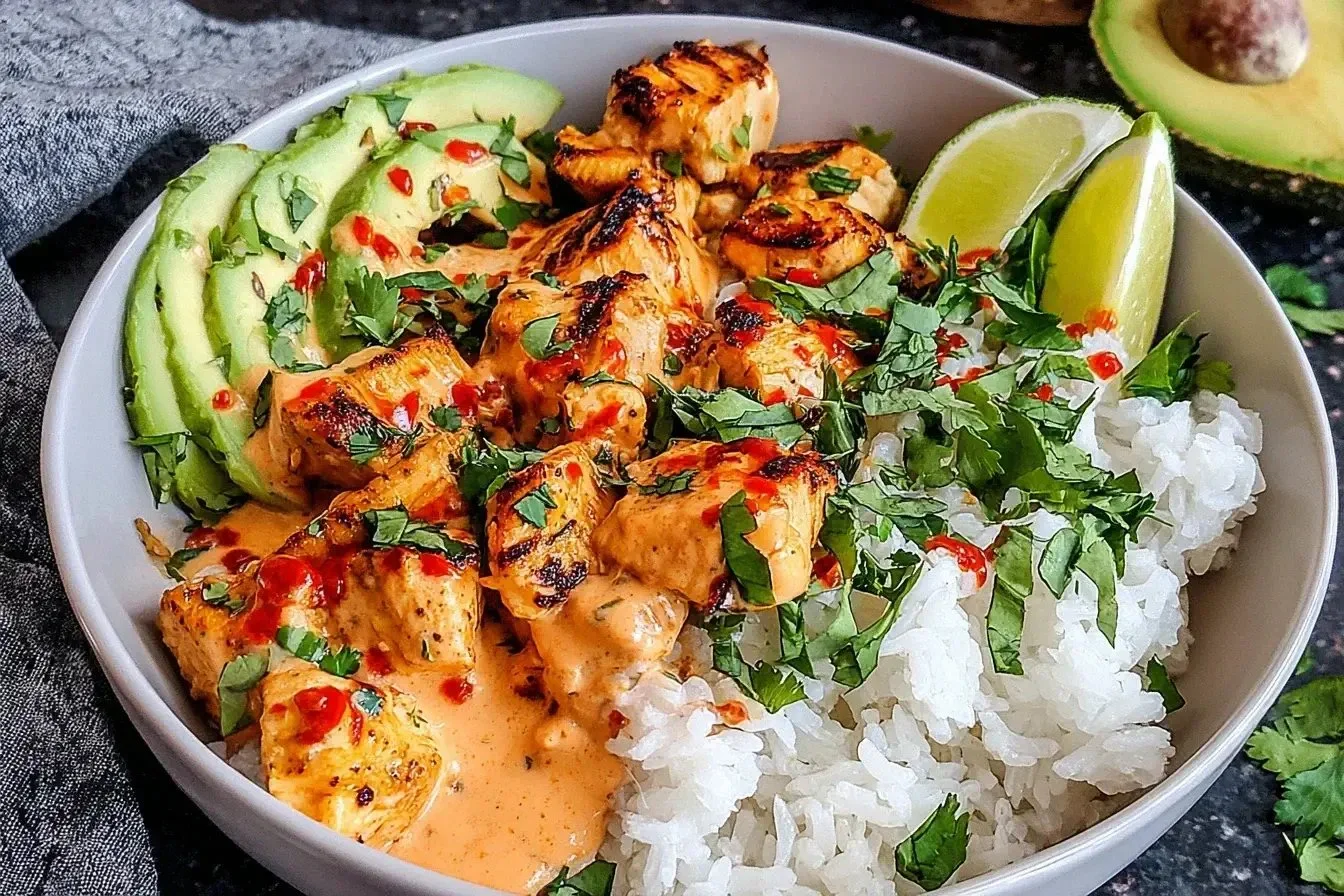 Delicious Coconut Chicken Rice Bowl with fresh ingredients and coconut flavor.