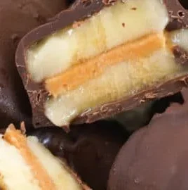 Frozen chocolate peanut butter banana bites on a plate