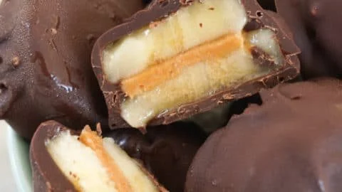 Frozen chocolate peanut butter banana bites on a plate