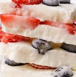 Delicious homemade frozen yogurt bark topped with fruits and nuts