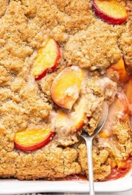 Healthy peach cobbler dessert topped with fresh peaches and wholesome ingredients